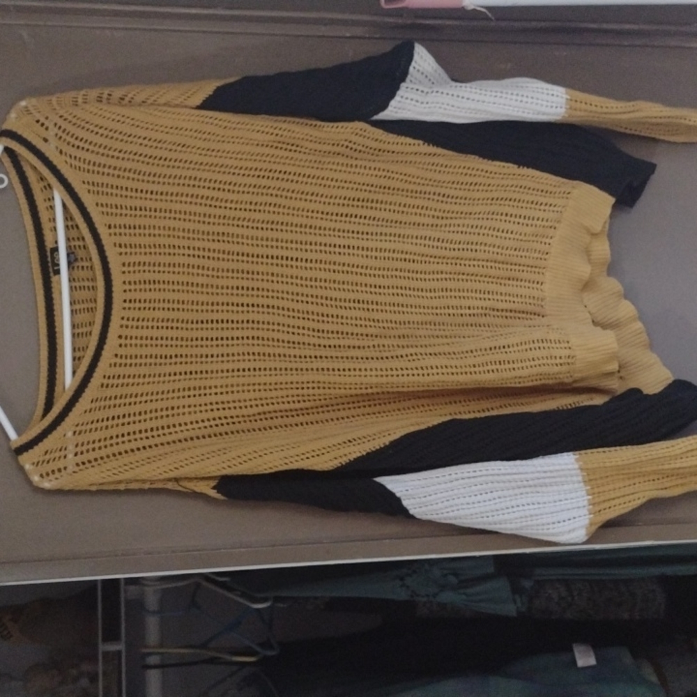 A women's long sleeve sweater